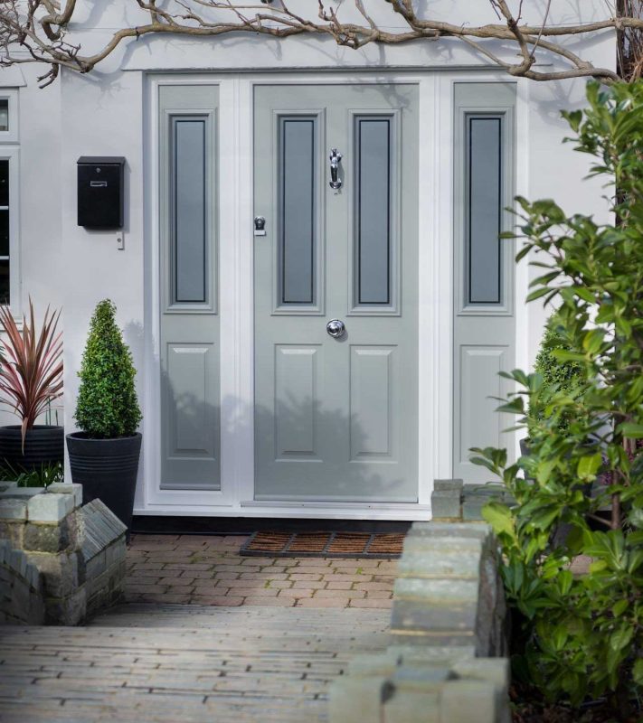 light grey composite door with two rectangular double glazed panes on a white home in cardigan